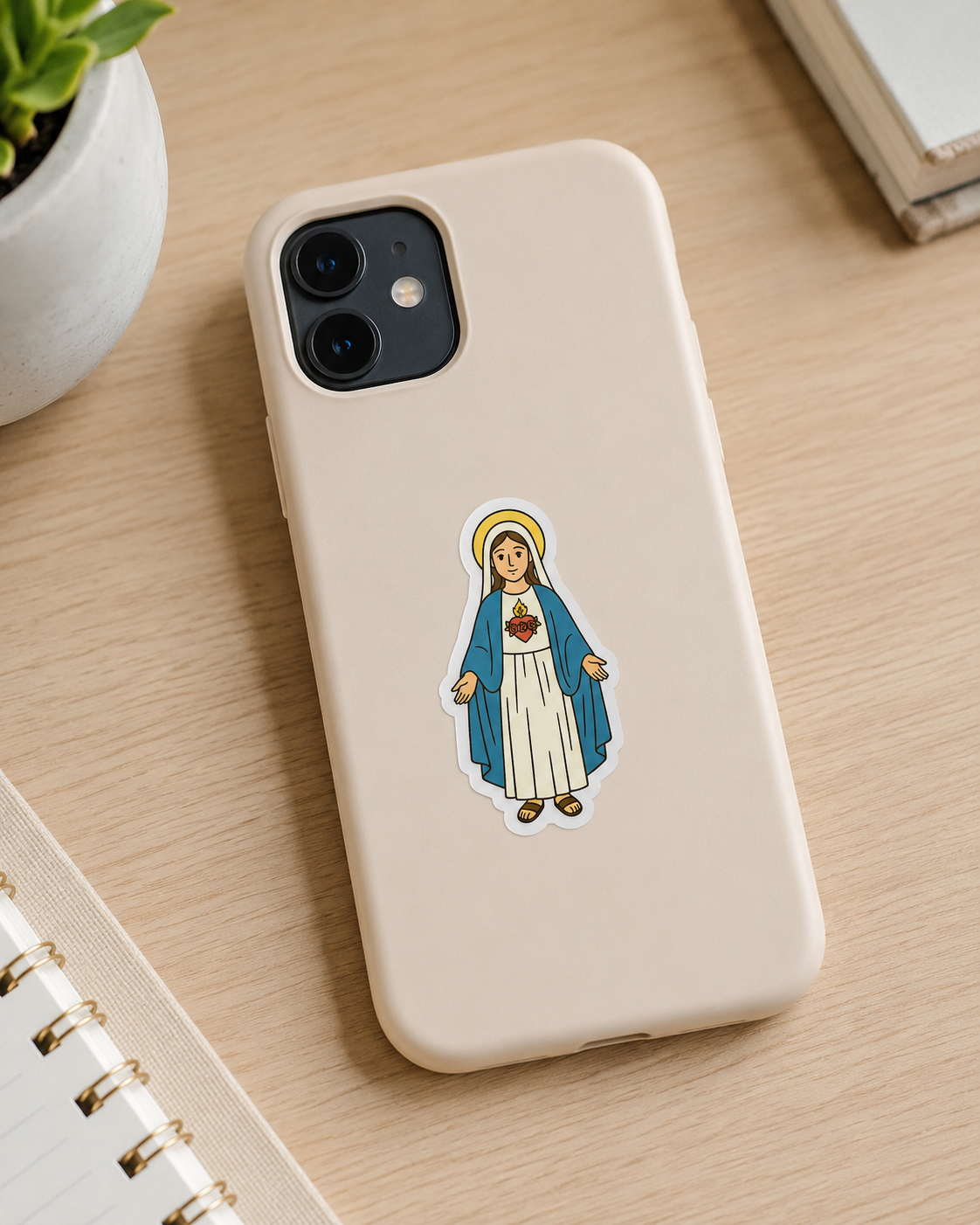 Immaculate Heart of Mary vinyl sticker on a phone case.